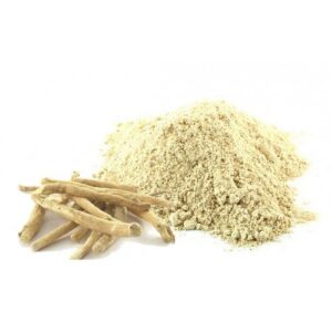 A small pile of pale powder next to several pieces of dried root.